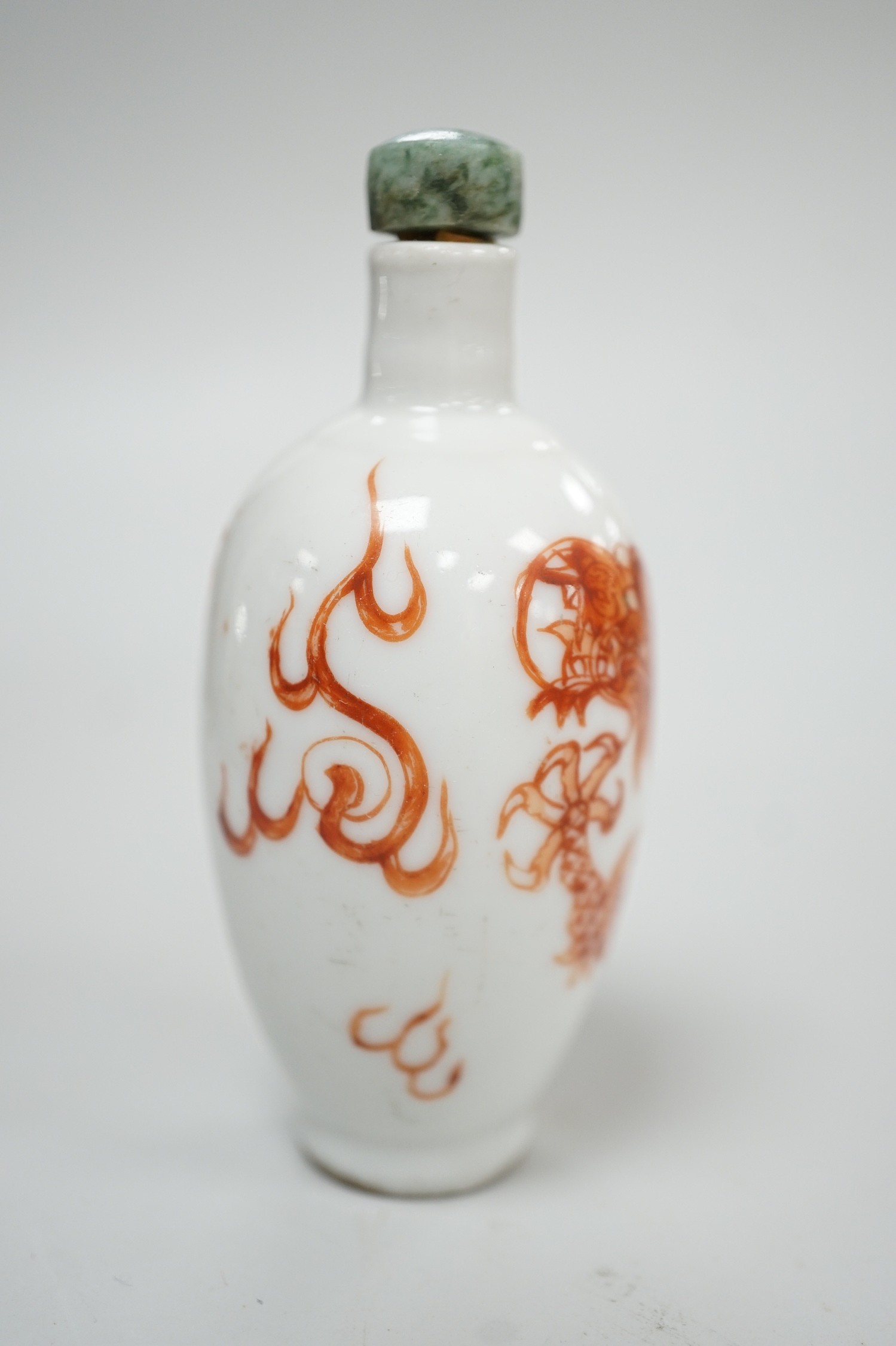 A Chinese rouge-de-fer 'dragon' snuff bottle, late 19th century, 6.7cm
